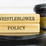 Whistleblower Policy text on wooden blocks. Whistleblower policy and law concept.