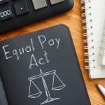 Equal Pay Act is shown on a business photo using the text