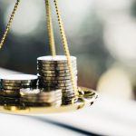 Coins stack with balance scale.