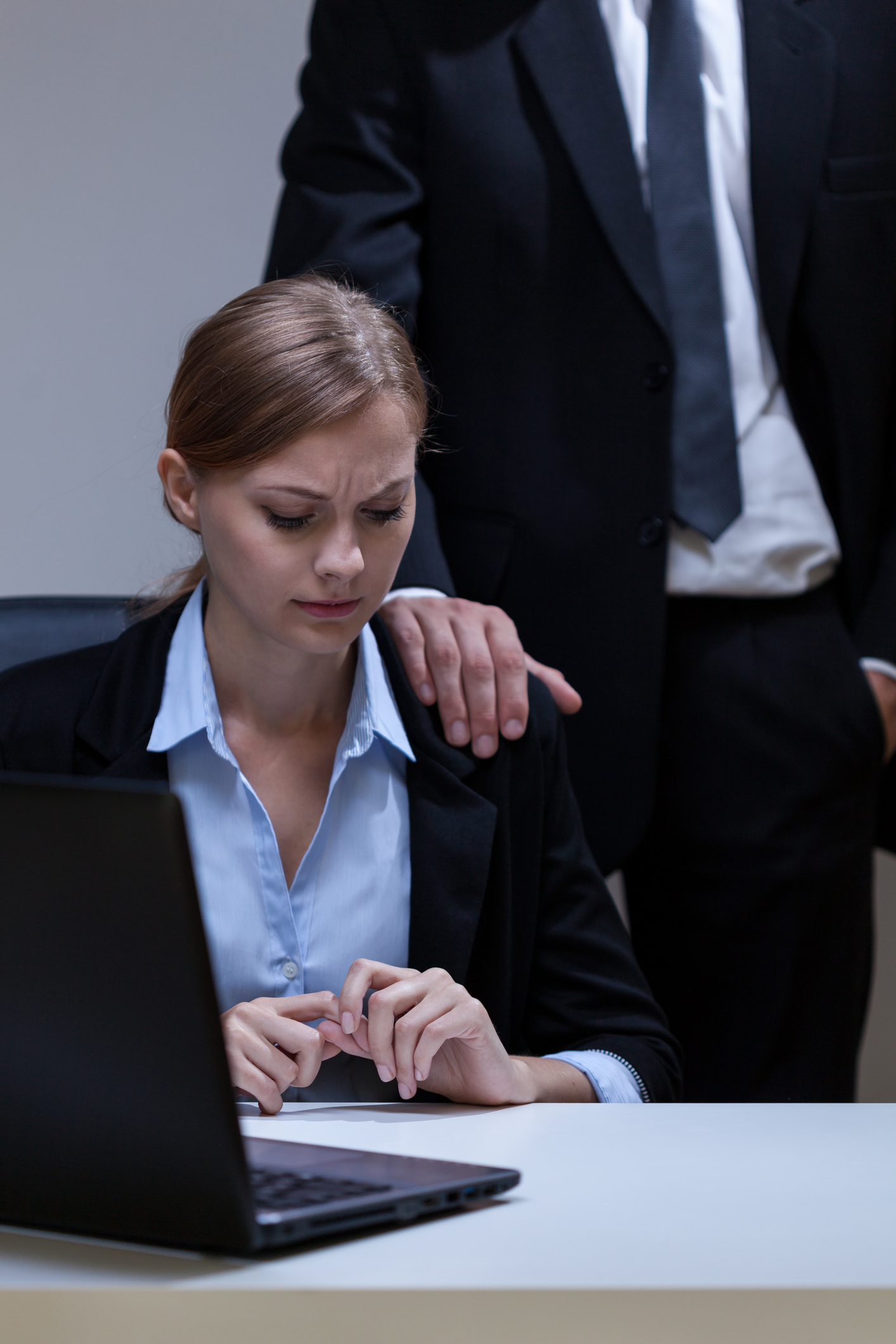 View of woman who doesn't like boss's touch